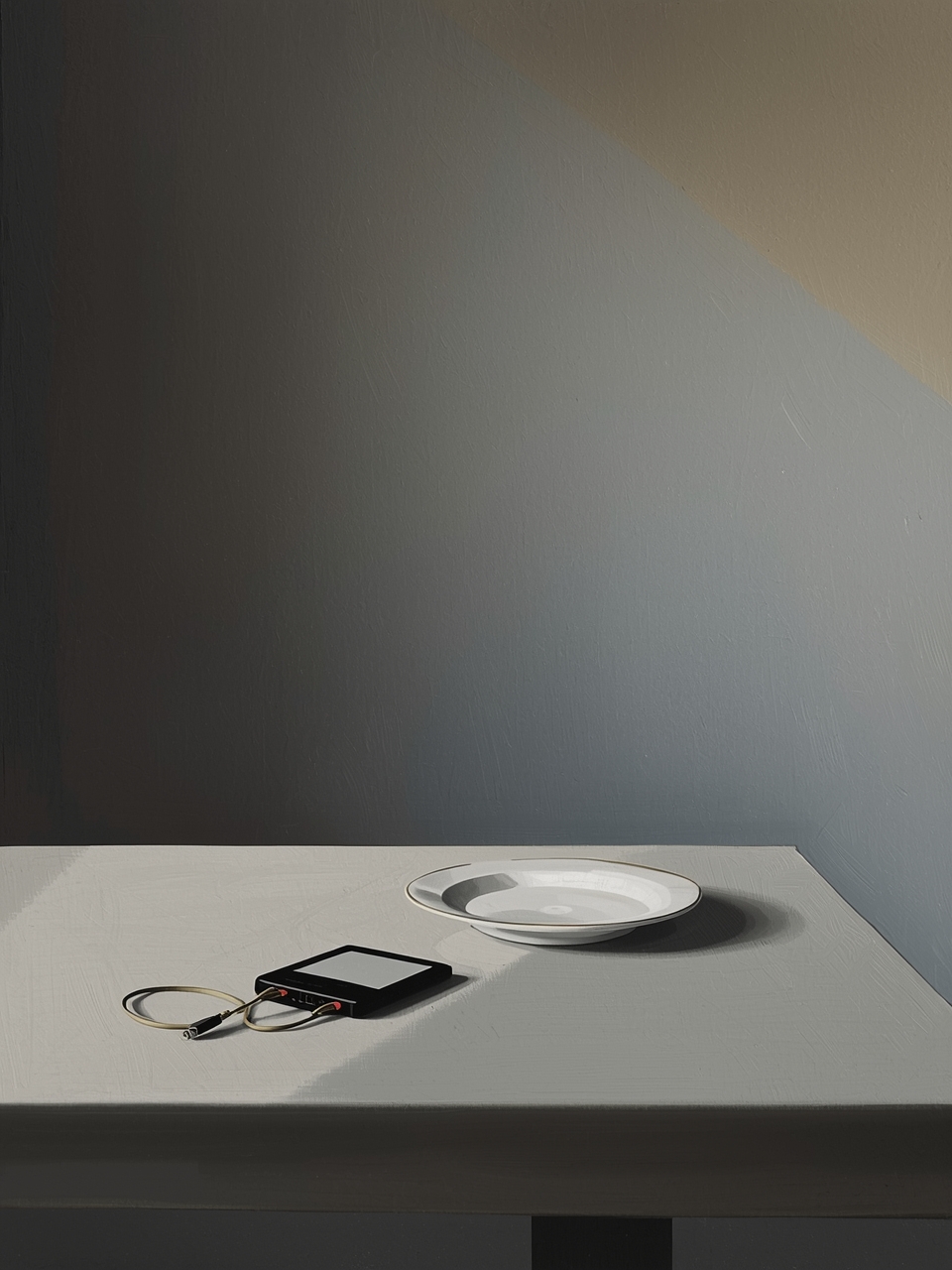 A quiet table with a small notebook and bowl in soft light
